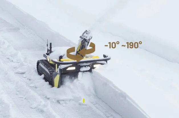The robot cutting through a deep snow trench with the chute rotation range of minus 10 to 190 degrees illustrated